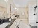 Luxurious bathroom with dual vanities, a soaking tub, and a walk-in shower at 4023 Randolph Rd, Charlotte, NC 28211