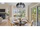 Cozy dining area featuring stylish decor, natural light, and a view of the backyard at 4023 Randolph Rd, Charlotte, NC 28211