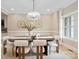 Stylish dining area with a modern light fixture, comfortable seating, and ample natural light at 4023 Randolph Rd, Charlotte, NC 28211