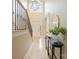 Bright foyer with high ceilings, staircase, and contemporary decor, creating a welcoming entrance at 4023 Randolph Rd, Charlotte, NC 28211