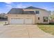 Spacious three car garage with carriage doors and a long driveway for ample parking at 4023 Randolph Rd, Charlotte, NC 28211