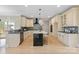 Modern kitchen features a center island, stainless steel appliances, and sleek cabinetry at 4023 Randolph Rd, Charlotte, NC 28211