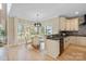 Open-concept kitchen with a view of the dining area and lots of natural light at 4023 Randolph Rd, Charlotte, NC 28211