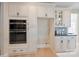 Modern kitchen with built-in appliances and beautiful cabinetry at 4023 Randolph Rd, Charlotte, NC 28211