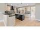 Well-equipped kitchen with a center island, modern lighting, and stainless steel appliances at 4023 Randolph Rd, Charlotte, NC 28211