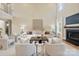 Inviting living room featuring a cozy fireplace, stylish seating, and plenty of natural light at 4023 Randolph Rd, Charlotte, NC 28211
