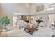 Open-concept living room with a high ceiling and a view of the kitchen at 4023 Randolph Rd, Charlotte, NC 28211