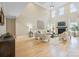Bright, airy living room with high ceilings, hardwood floors, fireplace, and ample seating at 4023 Randolph Rd, Charlotte, NC 28211