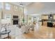 Open concept living room with fireplace flowing into the kitchen and dining area at 4023 Randolph Rd, Charlotte, NC 28211