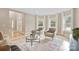 Bright living room with comfortable seating, large windows, and a welcoming atmosphere at 4023 Randolph Rd, Charlotte, NC 28211
