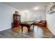 Well lit game room featuring hardwood floors, a pool table, classic furnishings and natural light at 3206 Thorpe Ln, Clover, SC 29710