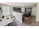 Bright kitchen and dining area with stainless steel appliances and convenient access to outdoor spaces at 805 W Main St, Marshville, NC 28103
