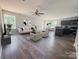 Open living room featuring modern furnishings, a ceiling fan, and durable flooring throughout at 805 W Main St, Marshville, NC 28103