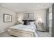 Serene main bedroom featuring a large bed, decorative pillows, framed art and contemporary lamps at 420 Serenity Cir, Cramerton, NC 28032