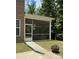This backyard has a screened-in porch and plenty of green space at 2044 Sweet William Dr, Harrisburg, NC 28075