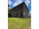 This property features a large, green lawn and brick-house exterior at 2044 Sweet William Dr, Harrisburg, NC 28075
