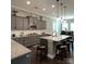 Modern kitchen with granite countertops, stainless steel appliances, and a stylish island with seating at 2044 Sweet William Dr, Harrisburg, NC 28075