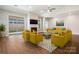 Bright living room featuring a fireplace, hardwood floors, and modern decor with lots of natural light at 833 B Wynnshire Dr # 55, Hickory, NC 28601