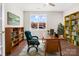 Functional home office featuring built-in bookcases, a desk, and a well-lit workspace at 833 B Wynnshire Dr # 55, Hickory, NC 28601