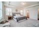 Neutral bedroom boasts tray ceiling, ensuite access and large windows for great light at 128 Summerhill Dr # 17, Mooresville, NC 28115