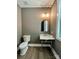Stylish half bathroom with unique sink and gold accents at 416 Plantation Way, Mount Gilead, NC 27306