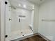 Elegant bathroom with a spacious, glass-enclosed shower featuring white subway tile and a built-in seat at 416 Plantation Way, Mount Gilead, NC 27306