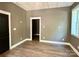 Neutral bedroom featuring new floors, white trim and large window at 416 Plantation Way, Mount Gilead, NC 27306