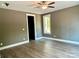 Neutral bedroom with wood floors, ceiling fan and window at 416 Plantation Way, Mount Gilead, NC 27306