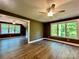Spacious bonus room with wood-look floors, a neutral-toned wall, and large windows with natural views at 416 Plantation Way, Mount Gilead, NC 27306