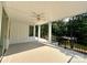 Large, covered outdoor deck overlooking a lush backyard and waterfront at 416 Plantation Way, Mount Gilead, NC 27306