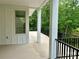Spacious covered deck featuring neutral flooring, white columns and a view of the surrounding landscape at 416 Plantation Way, Mount Gilead, NC 27306