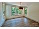 Bright dining room showcasing large windows with natural light and backyard views at 416 Plantation Way, Mount Gilead, NC 27306