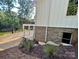 Exterior view showcasing the brick foundation and side deck with beautiful views of the lake at 416 Plantation Way, Mount Gilead, NC 27306