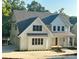 Beautiful two-story home with white siding, dark roof, and well-manicured lawn at 416 Plantation Way, Mount Gilead, NC 27306
