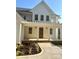 Charming front porch with a craftsman-style wood door and professionally landscaped front yard at 416 Plantation Way, Mount Gilead, NC 27306