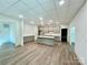 Bright kitchen with custom cabinetry, a large island, and modern appliances, perfect for entertaining at 416 Plantation Way, Mount Gilead, NC 27306