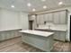 Well-appointed kitchen featuring modern appliances, custom cabinets, and a center island at 416 Plantation Way, Mount Gilead, NC 27306