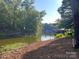 Beautiful lake view lot with mature trees and calm water for boating and recreation at 416 Plantation Way, Mount Gilead, NC 27306