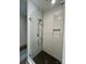 Modern glass shower features white subway tile and a black mosaic tile floor at 416 Plantation Way, Mount Gilead, NC 27306