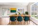 Dining room with a bright table, colorful art and sliding doors to the outdoor area at 831 B Wynnshire Dr # 60, Hickory, NC 28601