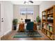 Cozy home office featuring built-in bookshelves, a large window, and a vintage desk at 831 B Wynnshire Dr # 60, Hickory, NC 28601