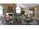 Inviting lounge area features comfortable seating, tables, fireplace and a TV, creating a perfect space for relaxation and socializing at 831 B Wynnshire Dr # 60, Hickory, NC 28601