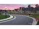 Beautiful neighborhood street with sidewalks, street lights, and manicured landscaping at sunset at 831 B Wynnshire Dr # 60, Hickory, NC 28601