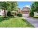 Charming home with stone accents, a well-manicured lawn, and a welcoming front entrance at 2907 Meherrin Ct, Waxhaw, NC 28173