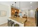 Modern kitchen with granite countertops, stainless steel appliances, and pendant lighting at 2907 Meherrin Ct, Waxhaw, NC 28173