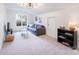 Large living room featuring a comfortable couch, modern lighting, and a serene atmosphere at 2907 Meherrin Ct, Waxhaw, NC 28173