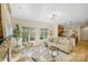 Open-concept living room showcasing fireplace, kitchen with modern appliances, and natural light at 2907 Meherrin Ct, Waxhaw, NC 28173