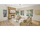 Cozy living room with a stone fireplace, comfortable seating, and sunlit windows at 2907 Meherrin Ct, Waxhaw, NC 28173