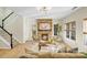 Inviting living room showcasing a stone fireplace and a staircase leading to the second floor at 2907 Meherrin Ct, Waxhaw, NC 28173