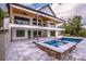 Inviting backyard featuring a pool, spa, and spacious patio for outdoor gatherings with lake view at 110 Emmaline Ct, Troutman, NC 28166